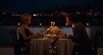 Movie still from “The Parent Trap” (1998), directed by Nancy Meyers – A man and a woman sitting at a dinner table; Medium shot, High angle