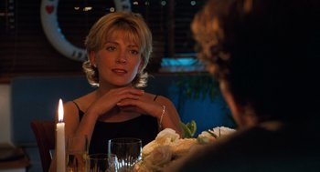Movie still from “The Parent Trap” (1998), directed by Nancy Meyers – A woman sitting at a table with a glass of wine; Close Up shot, Over the shoulder angle