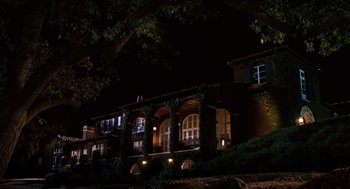 Movie still from “The Parent Trap” (1998), directed by Nancy Meyers – A building lit up at night with lights on; Extreme Wide shot, Low angle