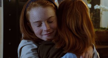 Movie still from “The Parent Trap” (1998), directed by Nancy Meyers – A person hugging another person; Close Up shot, High angle