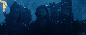 Movie still from “The Passion of the Christ” (2004), directed by Mel Gibson – A group of men standing next to each other in the dark; Medium shot, Low angle