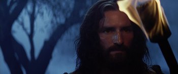 Movie still from “The Passion of the Christ” (2004), directed by Mel Gibson – A person with long hair and a beard; Close Up shot, Low angle