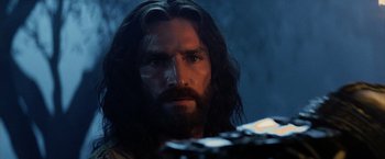 Movie still from “The Passion of the Christ” (2004), directed by Mel Gibson – A person with long hair and a beard; Close Up shot, Low angle