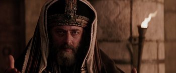 Movie still from “The Passion of the Christ” (2004), directed by Mel Gibson – A man with a beard wearing a crown and a robe; Close Up shot, Low angle