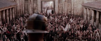 Movie still from “The Passion of the Christ” (2004), directed by Mel Gibson – A crowd of people in front of a building; Extreme Wide shot, High angle
