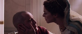 Movie still from “The Passion of the Christ” (2004), directed by Mel Gibson – An older man and a younger woman face to face; Close Up shot, Low angle