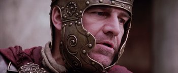 Movie still from “The Passion of the Christ” (2004), directed by Mel Gibson – A person wearing a helmet; Close Up shot, Low angle