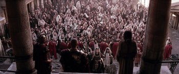 Movie still from “The Passion of the Christ” (2004), directed by Mel Gibson – A group of people sitting in front of an audience; Extreme Wide shot, High angle