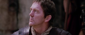 Movie still from “The Passion of the Christ” (2004), directed by Mel Gibson – A person wearing a leather jacket; Close Up shot, Over the shoulder angle