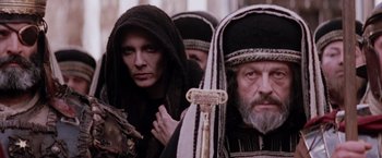 Movie still from “The Passion of the Christ” (2004), directed by Mel Gibson – A group of men in traditional clothing standing next to each other; Close Up shot, Low angle