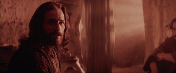 Movie still from “The Passion of the Christ” (2004), directed by Mel Gibson – A man with long hair and a beard is holding a cup; Close Up shot, Low angle
