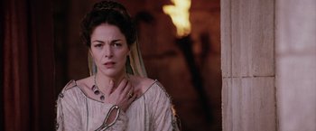 Movie still from “The Passion of the Christ” (2004), directed by Mel Gibson – A woman in a medieval dress holding her hand to her chest; Close Up shot, Over the shoulder angle