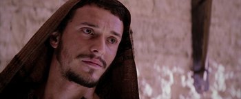 Movie still from “The Passion of the Christ” (2004), directed by Mel Gibson – A person with a beard wearing a headscarf; Close Up shot, Low angle