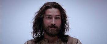 Movie still from “The Passion of the Christ” (2004), directed by Mel Gibson – A person with long hair and a beard; Close Up shot, High angle