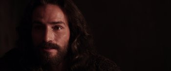 Movie still from “The Passion of the Christ” (2004), directed by Mel Gibson – A person with long hair and a beard; Close Up shot, Low angle
