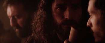 Movie still from “The Passion of the Christ” (2004), directed by Mel Gibson – A person with long hair and a beard; Close Up shot, Low angle
