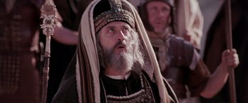Movie still from “The Passion of the Christ” (2004), directed by Mel Gibson – An old man with a beard wearing a turban; Close Up shot, Low angle