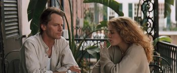 Movie still from “The Pelican Brief” (1993), directed by Alan J. Pakula – A man and a woman sitting next to each other; Close Up shot, Over the shoulder angle