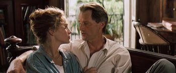 Movie still from “The Pelican Brief” (1993), directed by Alan J. Pakula – A man and a woman standing next to each other; Close Up shot, Low angle