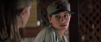 Movie still from “The Pelican Brief” (1993), directed by Alan J. Pakula – A person wearing a hat; Close Up shot, Over the shoulder angle