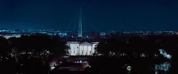 Movie still from “The Pelican Brief” (1993), directed by Alan J. Pakula – The white house is lit up at night time; Extreme Wide shot, Low angle