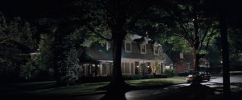 Movie still from “The Pelican Brief” (1993), directed by Alan J. Pakula – A large tree in front of a house at night; Extreme Wide shot, High angle