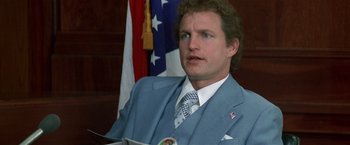 Movie still from “The People vs. Larry Flynt” (1996), directed by Milos Forman – A person wearing a suit and tie; Close Up shot, Low angle