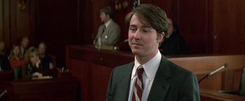 Movie still from “The People vs. Larry Flynt” (1996), directed by Milos Forman – A man in a suit and tie in front of a judge; Close Up shot, Low angle