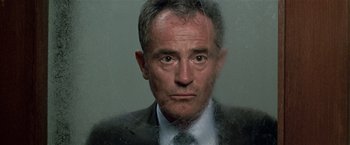 Movie still from “The People vs. Larry Flynt” (1996), directed by Milos Forman – A person wearing a suit and tie; Close Up shot, Low angle