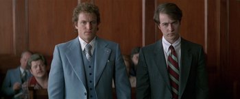 Movie still from “The People vs. Larry Flynt” (1996), directed by Milos Forman – Two men in suits standing next to each other in a courtroom; Medium shot, Low angle