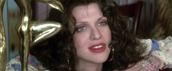 Movie still from “The People vs. Larry Flynt” (1996), directed by Milos Forman – A person with curly hair and green eyes; Close Up shot, Low angle