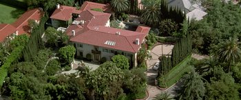 Movie still from “The People vs. Larry Flynt” (1996), directed by Milos Forman – An aerial view of a house with a car parked in front of it; Extreme Wide shot, High angle