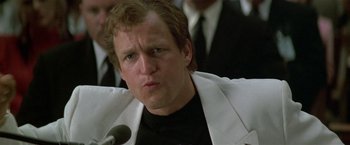 Movie still from “The People vs. Larry Flynt” (1996), directed by Milos Forman – A person wearing a suit and tie; Close Up shot, Low angle