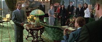 Movie still from “The People vs. Larry Flynt” (1996), directed by Milos Forman – A group of people standing in a living room; Wide shot, Over the shoulder angle