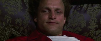 Movie still from “The People vs. Larry Flynt” (1996), directed by Milos Forman – A man's face in a red shirt; Close Up shot, Low angle