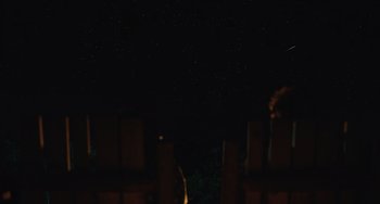 Movie still from “Save Yourselves!” (2020), directed by Eleanor Wilson – A night sky filled with stars in the dark; Extreme Wide shot, Low angle