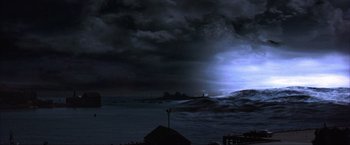 Movie still from “The Perfect Storm” (2000), directed by Wolfgang Petersen – A storm is coming in from the ocean; Extreme Wide shot, High angle