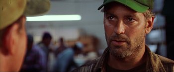 Movie still from “The Perfect Storm” (2000), directed by Wolfgang Petersen – A person wearing a hat; Close Up shot, Over the shoulder angle