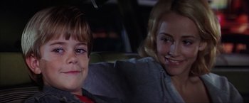 Movie still from “The Perfect Storm” (2000), directed by Wolfgang Petersen – A young boy and a young girl sitting in the back of a car; Close Up shot, Over the shoulder angle