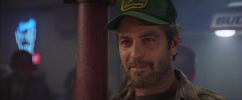 Movie still from “The Perfect Storm” (2000), directed by Wolfgang Petersen – A person wearing a hat; Close Up shot, Over the shoulder angle