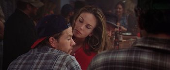 Movie still from “The Perfect Storm” (2000), directed by Wolfgang Petersen – A man and a woman sitting in front of each other; Close Up shot, Over the shoulder angle