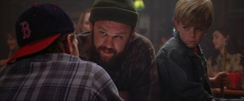 Movie still from “The Perfect Storm” (2000), directed by Wolfgang Petersen – A man with a beard wearing a green hat; Close Up shot, Over the shoulder angle