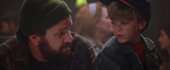 Movie still from “The Perfect Storm” (2000), directed by Wolfgang Petersen – A man and a boy sitting next to each other; Close Up shot, Over the shoulder angle