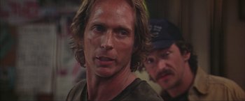 Movie still from “The Perfect Storm” (2000), directed by Wolfgang Petersen – A person with long hair; Close Up shot, Over the shoulder angle