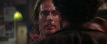 Movie still from “The Perfect Storm” (2000), directed by Wolfgang Petersen – A man's face as he stares at another man; Close Up shot, Over the shoulder angle