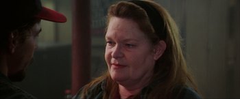 Movie still from “The Perfect Storm” (2000), directed by Wolfgang Petersen – An older woman is looking at the camera; Close Up shot, Over the shoulder angle