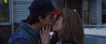 Movie still from “The Perfect Storm” (2000), directed by Wolfgang Petersen – A man and a woman kissing each other on the lips; Close Up shot, Over the shoulder angle