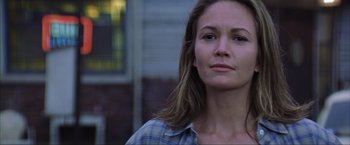 Movie still from “The Perfect Storm” (2000), directed by Wolfgang Petersen – A person wearing a plaid shirt; Close Up shot, Low angle