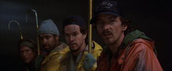 Movie still from “The Perfect Storm” (2000), directed by Wolfgang Petersen – A group of men standing next to each other; Close Up shot, Low angle