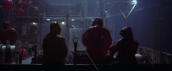 Movie still from “The Perfect Storm” (2000), directed by Wolfgang Petersen – A group of people standing next to each other in the dark; Medium shot, Low angle